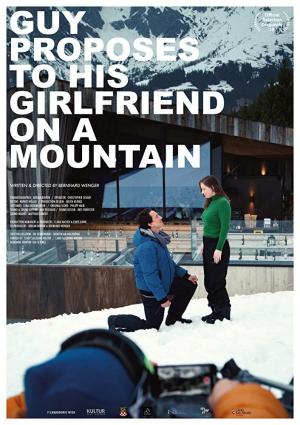 Guy proposes to his girlfriend on a mountain (C)