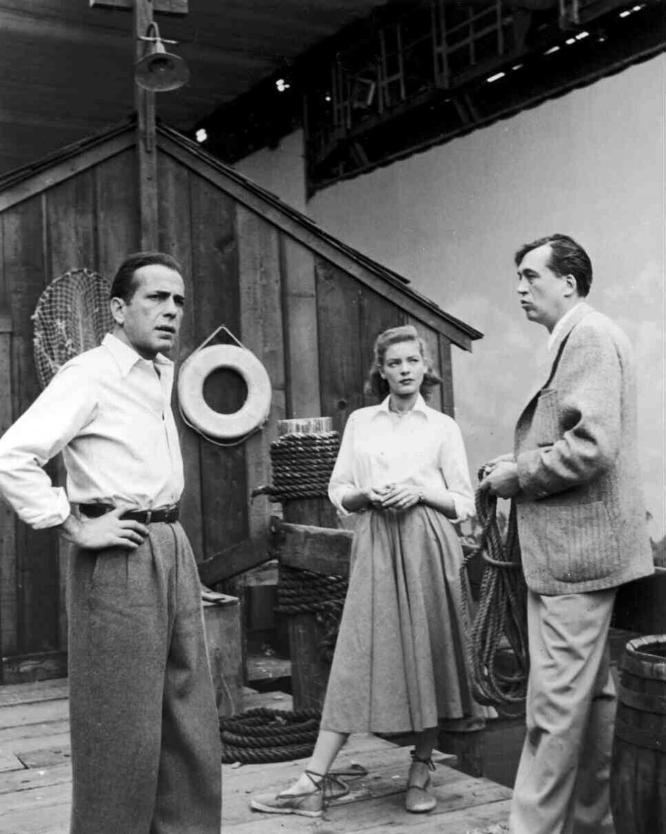 Humphrey Bogart, Lauren Bacall & director John Huston